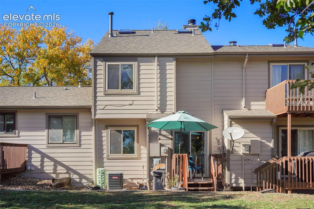Image 22 of 28: Multi-level exterior featuring horizontal siding, a second-story wooden dec