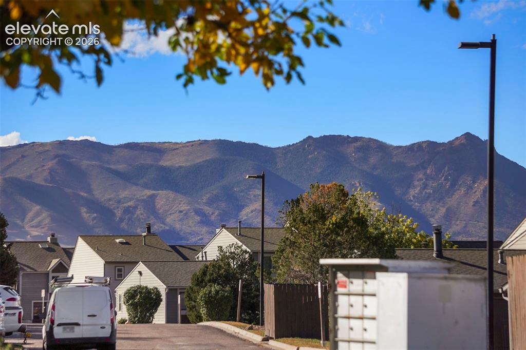 Image 3 of 28: Prominent mountain backdrop featuring varied terrain and ridges