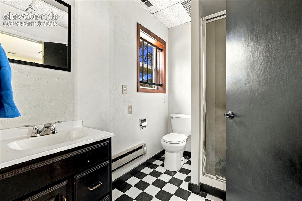 Image 32 of 43: Shop Bathroom