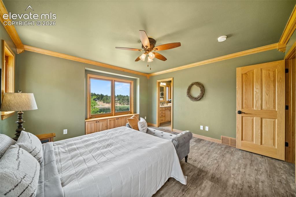 Image 13 of 30: Main level living room, dining area and kitchen