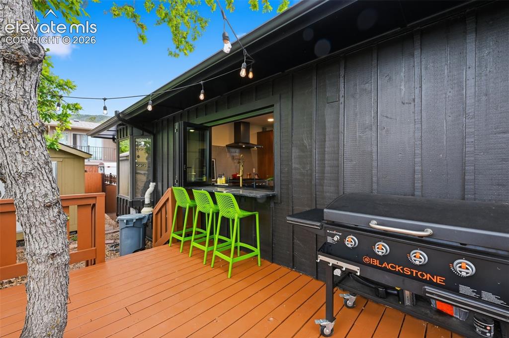 Image 11 of 50: Small deck just outside the kitchen window.
