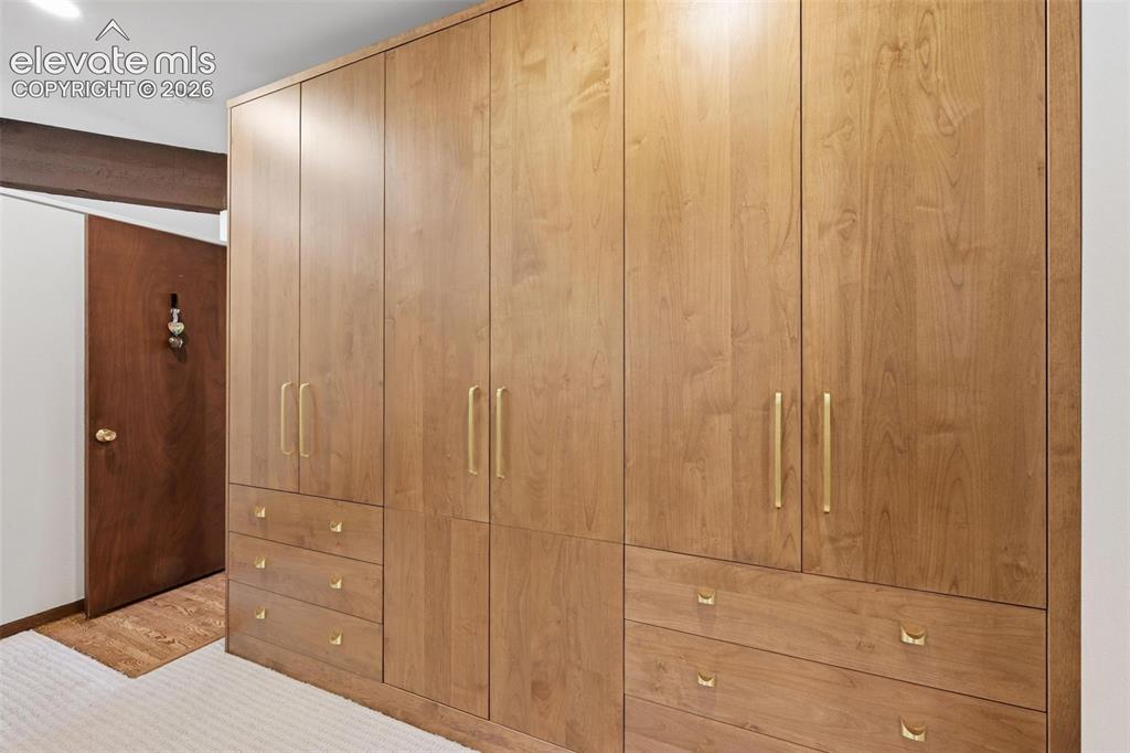 Image 25 of 50: New built-in custom closet.