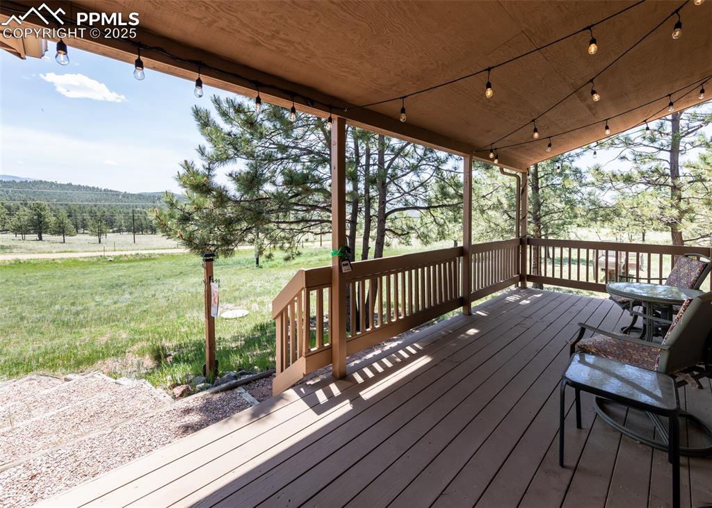 Image 12 of 48: Sunrise starts here. Relax on the covered front porch and take in the mount