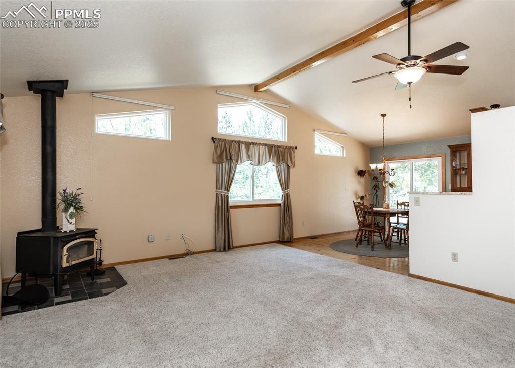 Image 14 of 48: The wood burning stove warms you in the cooler weather and the abundant win