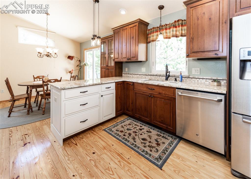 Image 20 of 48: View of kitchen into the dining room.