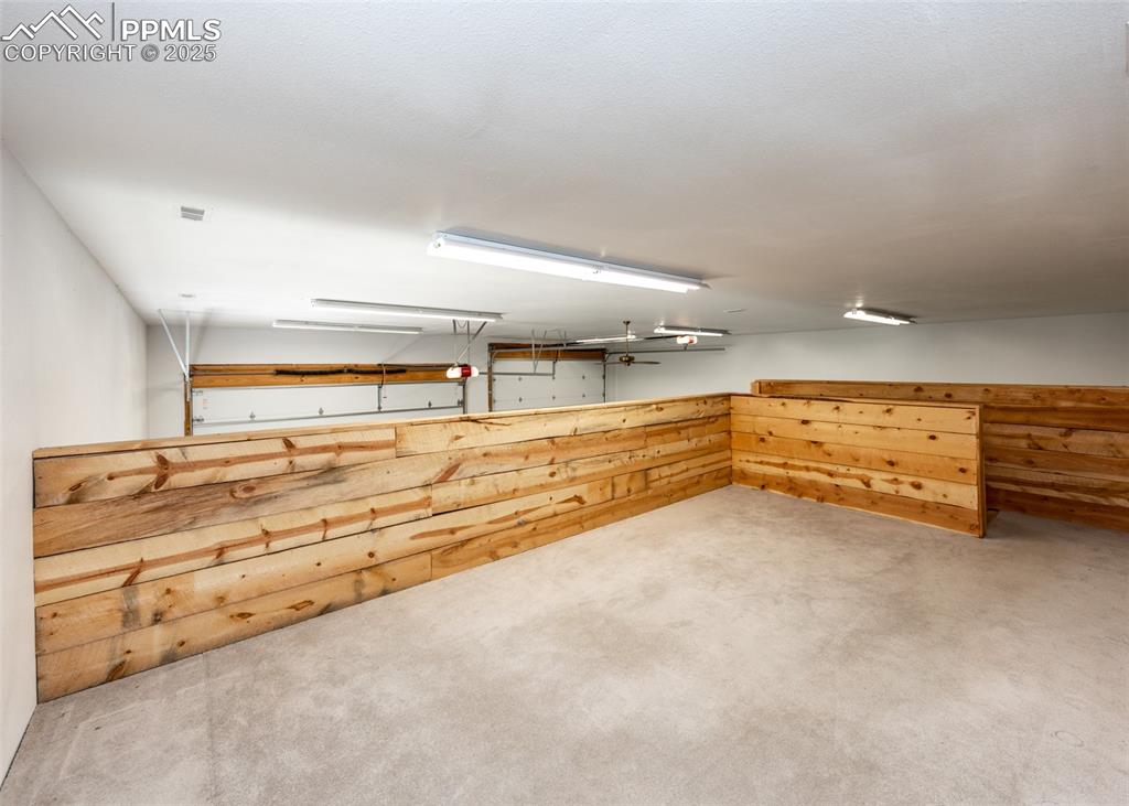 Image 9 of 48: Man cave loft above the workshop in the RV garage. 