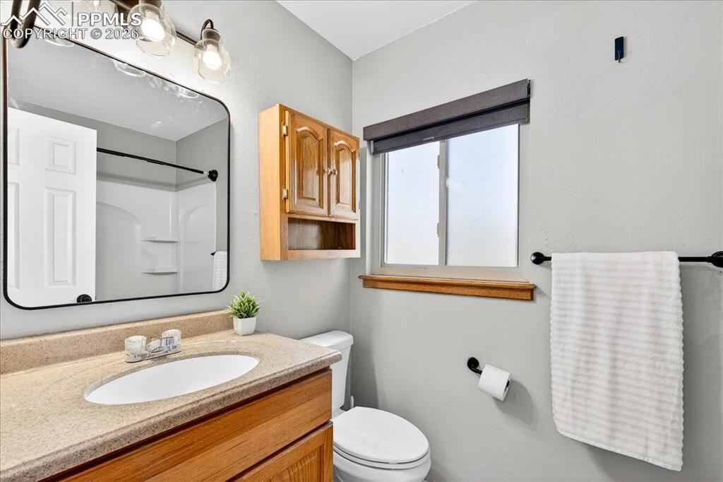 Image 30 of 49: Bathroom featuring vanity and a shower
