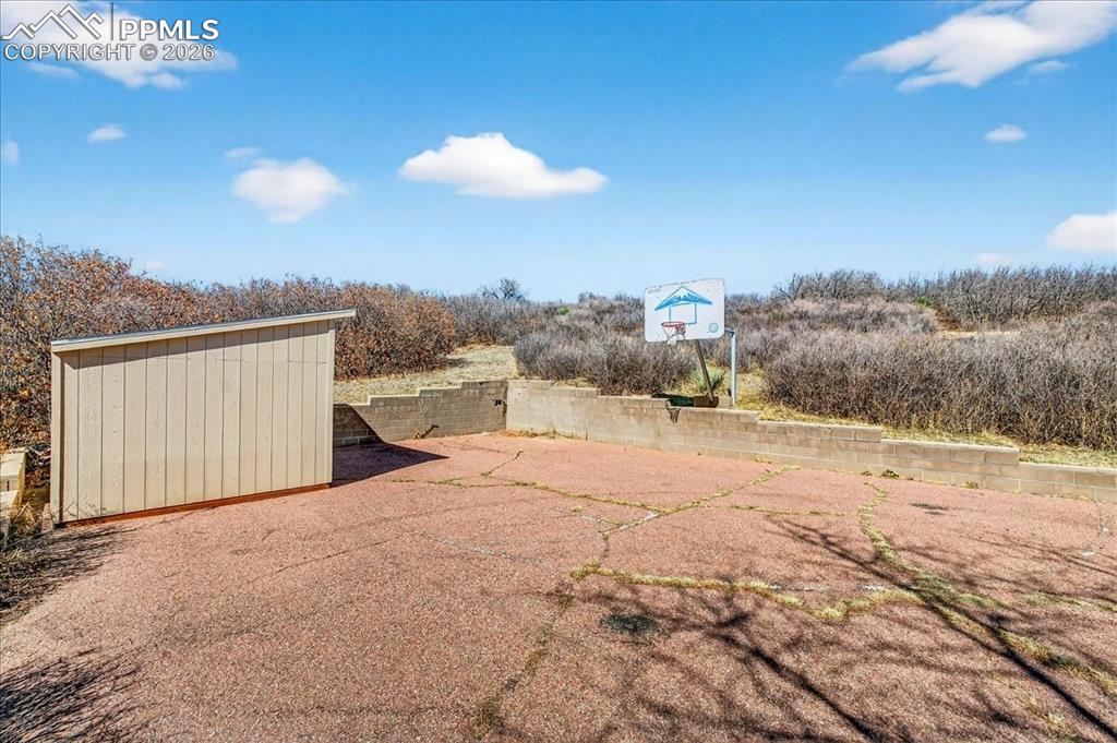 Image 38 of 49: View of yard featuring a shed