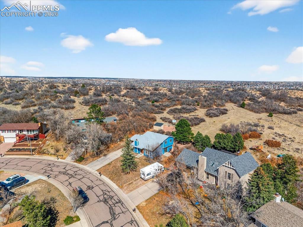 Image 41 of 49: Aerial view of sparsely populated area with a desert landscape