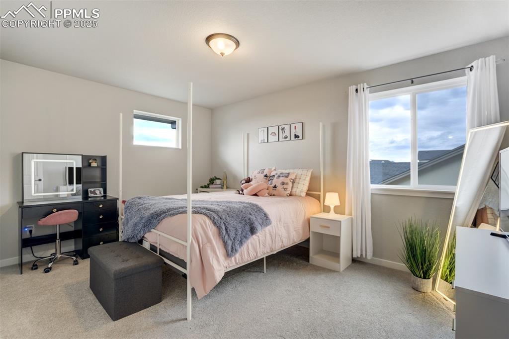 Image 25 of 49: A second bedroom on upper level