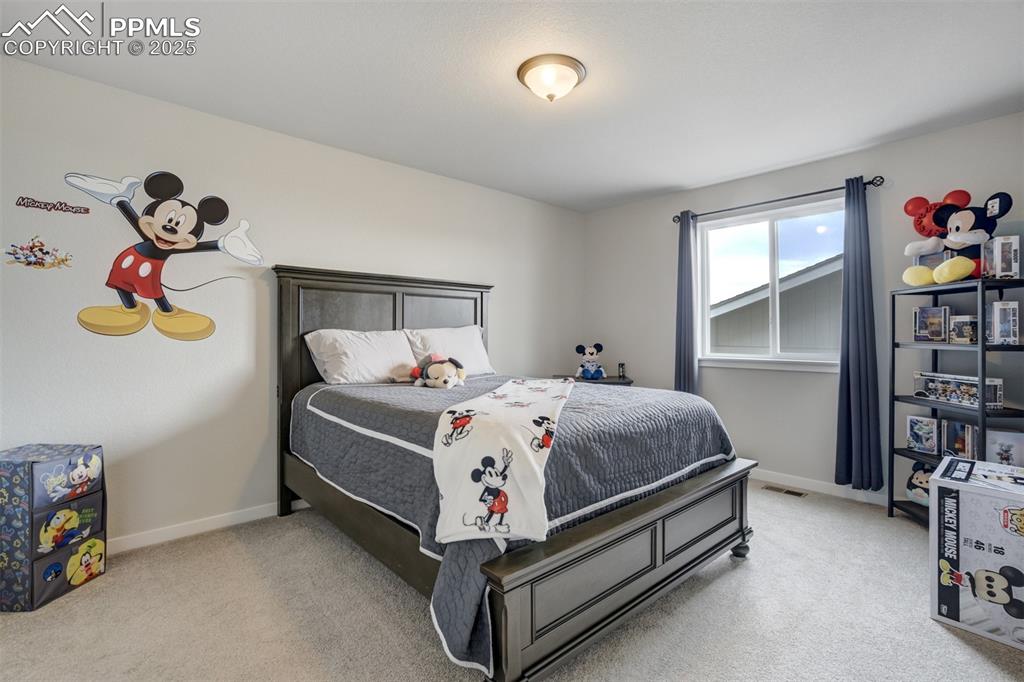 Image 27 of 49: Fourth bedroom on upper level