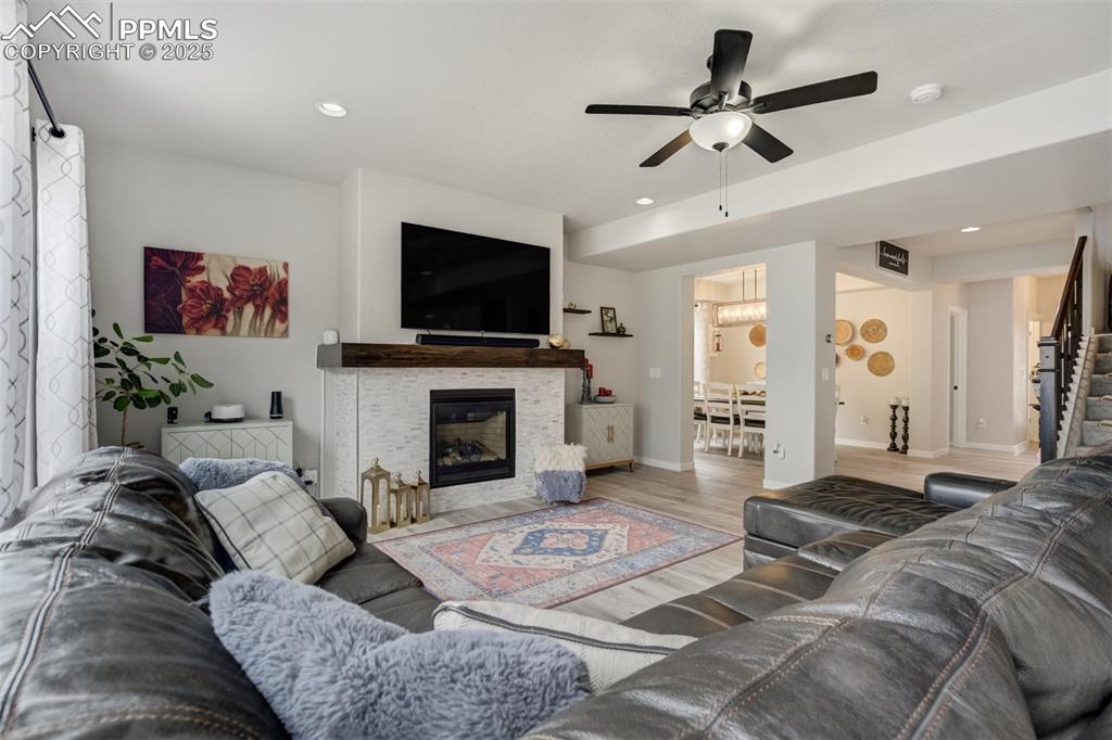 Image 3 of 49: Beautiful living room centers around a cozy fireplace