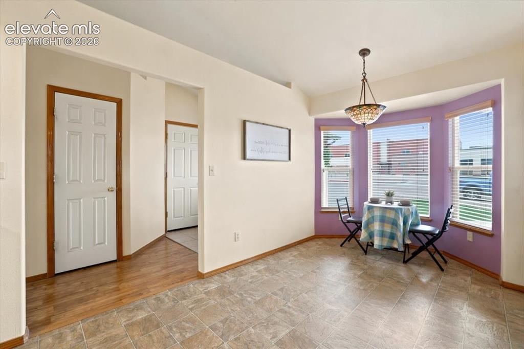 Image 11 of 50: Ample space for a large table in the kitchen