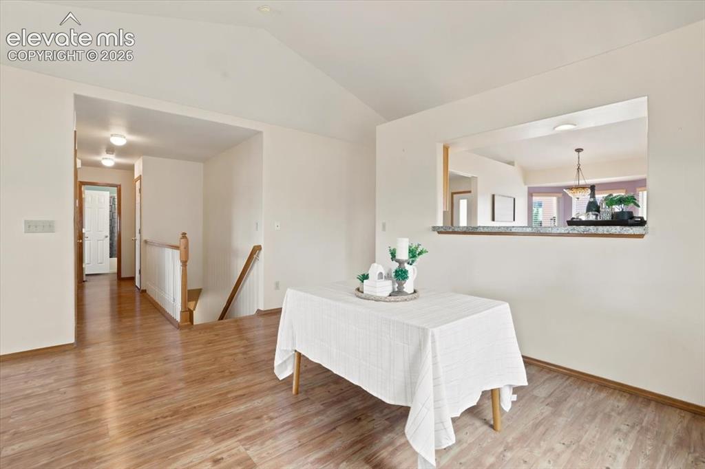 Image 12 of 50: Designated dining area attached to the living room