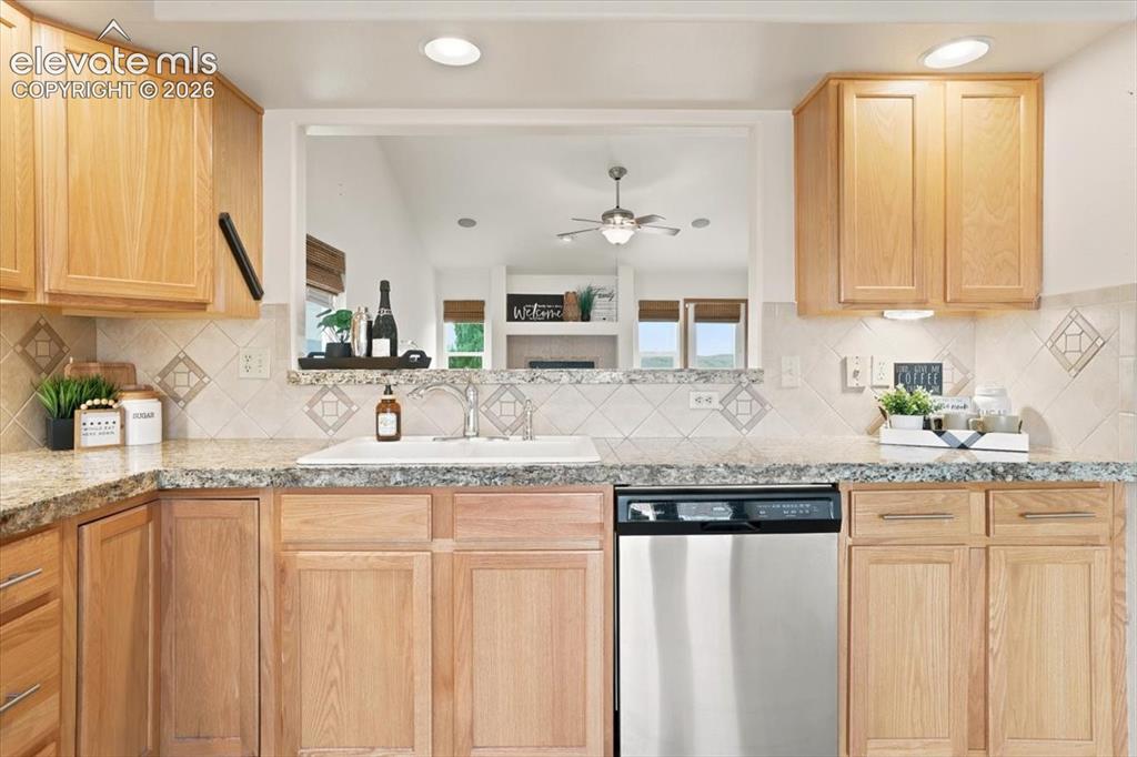 Image 7 of 50: Light bright kitchen with pass through into the dining room