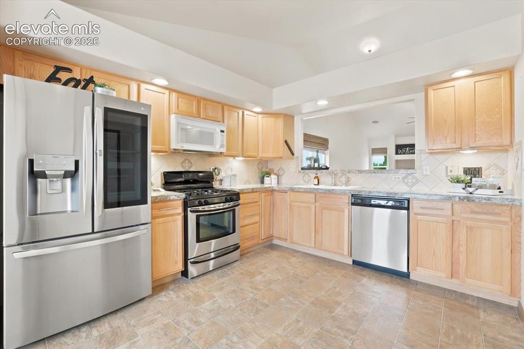 Image 8 of 50: Open kitchen allows for the addition of a movable island for additional wor