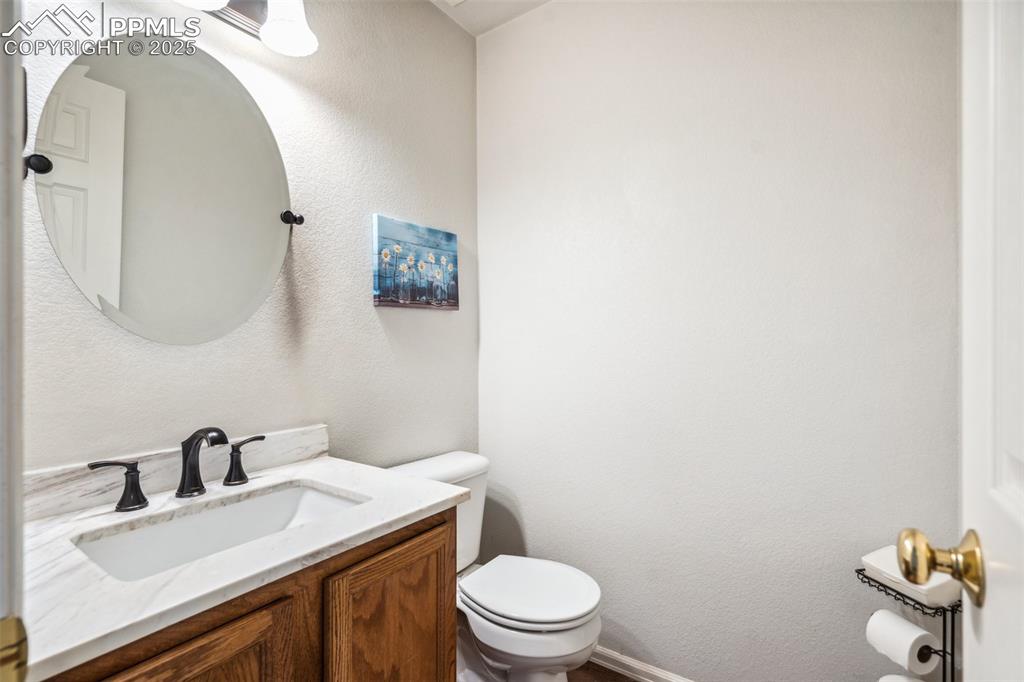 Image 16 of 31: Main level half bathroom