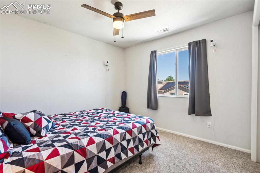 Image 20 of 31: Upper level bedroom 