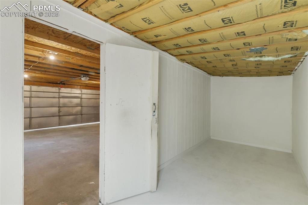 Image 35 of 38: Newly finished garage bonus space off the already massive garage. 19 x 7 fo