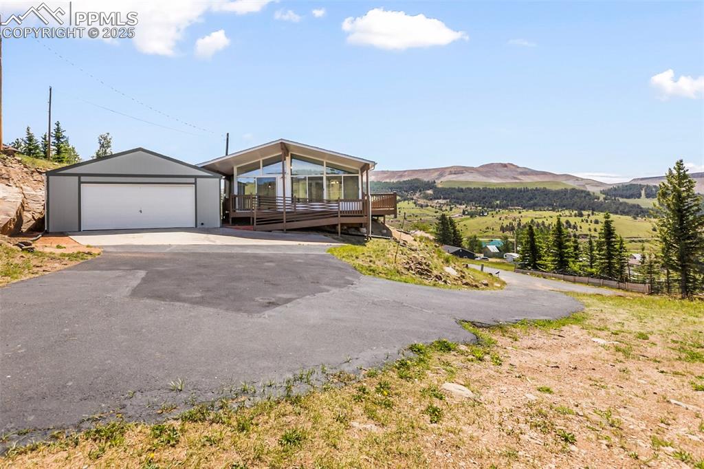 Image 38 of 38: Paved driveway. Surrounding mountain views. Over .25 acre lot.