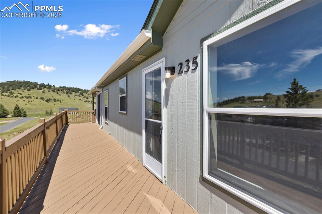 Image 4 of 38: Front Deck for outstanding views to western sunsets.