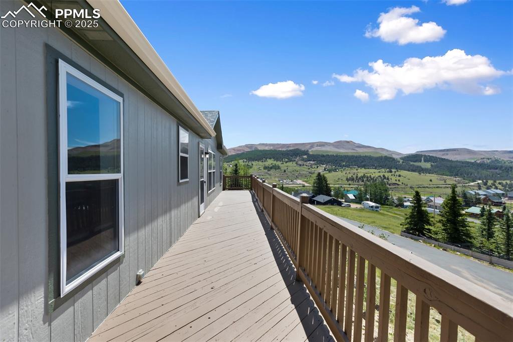 Image 5 of 38: Newly painted deck. All new exterior paint on the home.