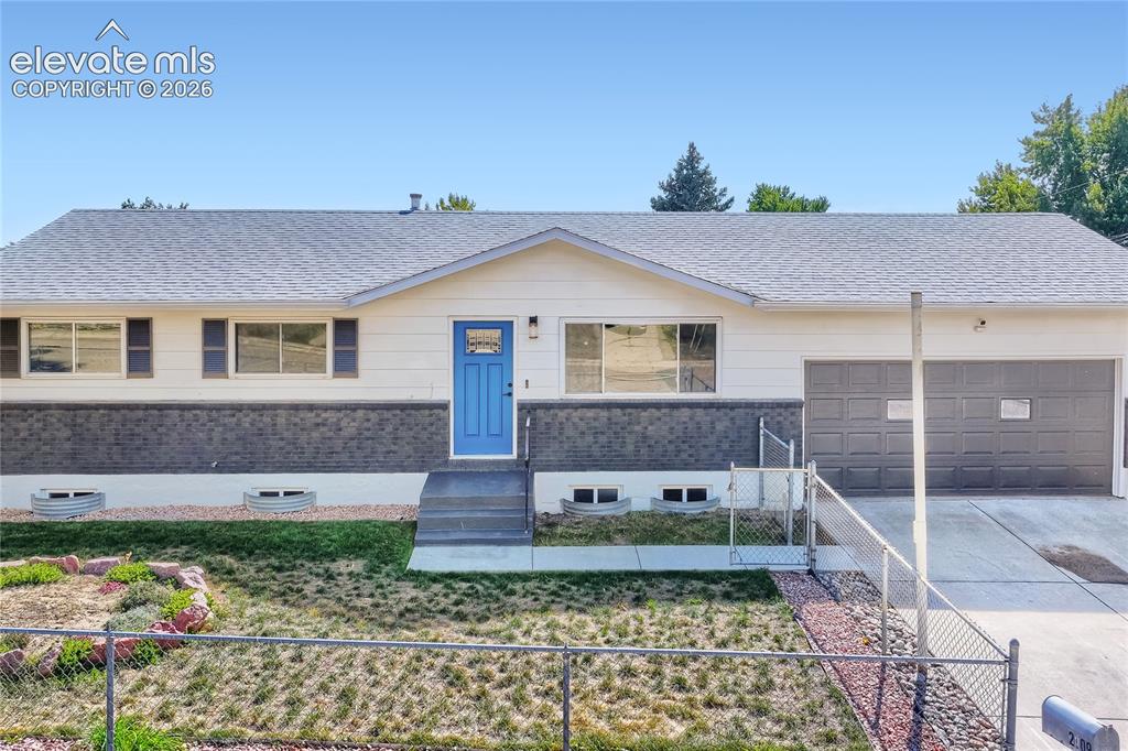 Image 2 of 42: Ranch-style residence featuring a gray shingle roof, white siding, and a da