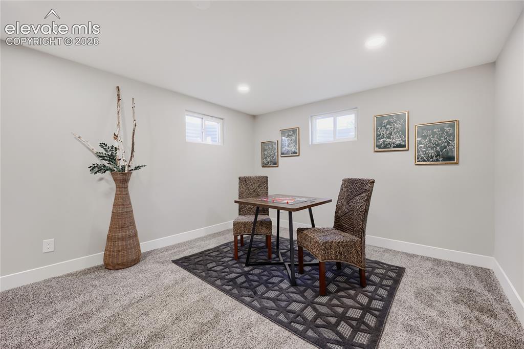 Image 26 of 42: Recessed lighting, light-colored walls, and carpeting