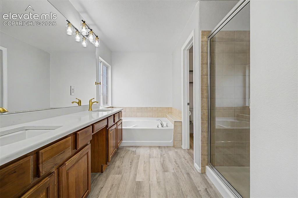 Image 16 of 33: Tucked conveniently on the main level, the powder room features a pedestal 