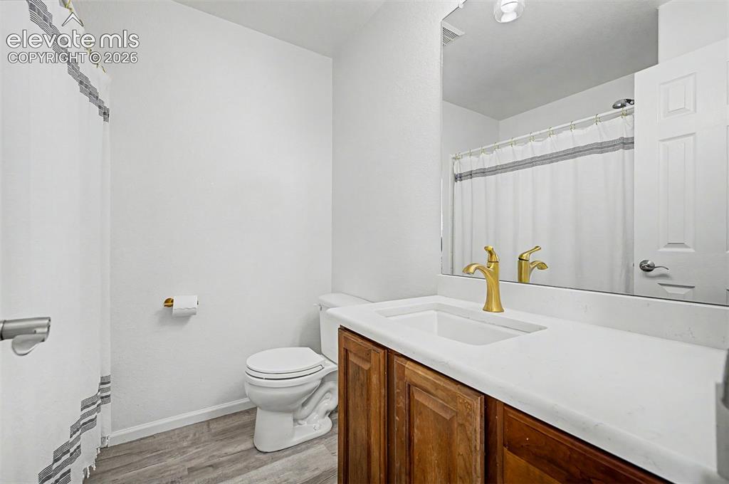 Image 19 of 33: Step outside from the primary suite onto this private covered balcony with 