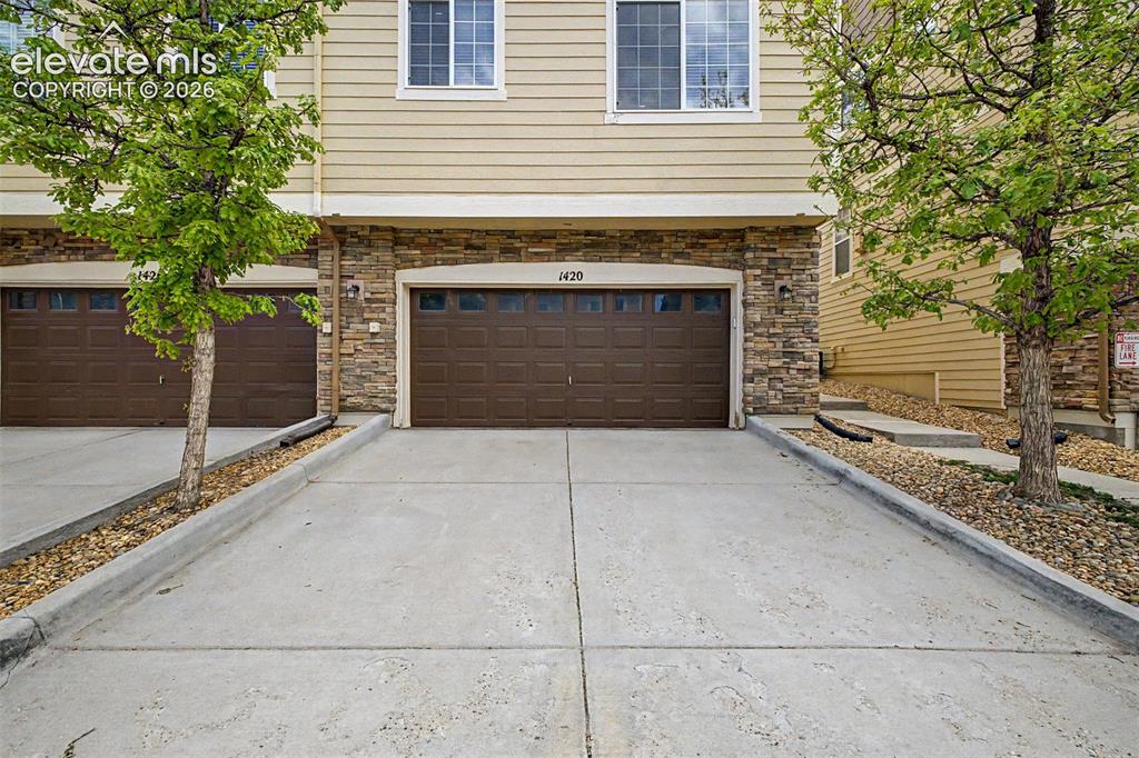 Image 25 of 33: A versatile third bedroom features vaulted ceilings, a large picture window