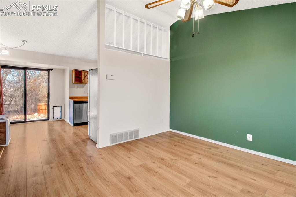Image 4 of 35: Ceiling fans in the living room and kitchen