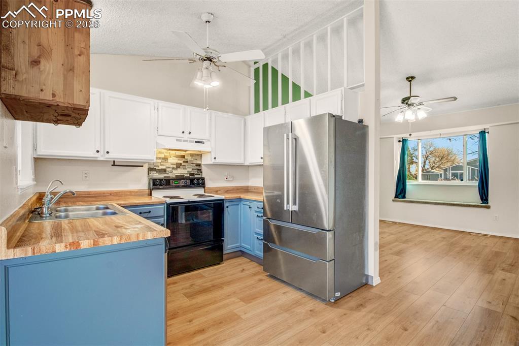 Image 6 of 35: Stainless steel refrigerator and dishwasher