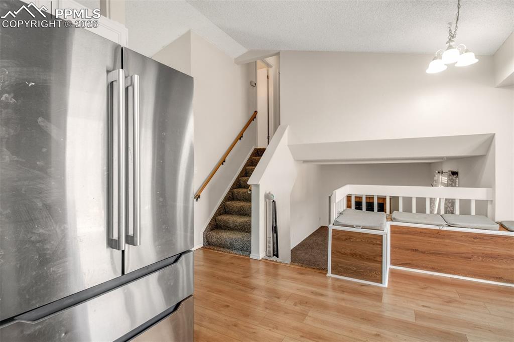 Image 8 of 35: Kitchen looking into dining area