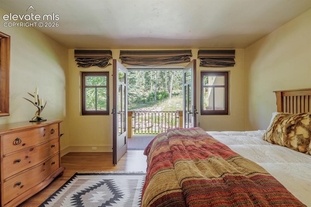 Image 17 of 49: Hall from the primary suite to the three bedroom suites