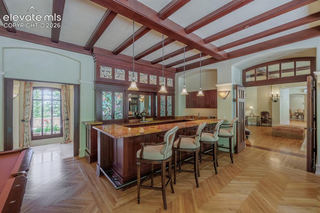 Image 23 of 49: Game room and bar off the living room with quarter sawn white oak floors fr