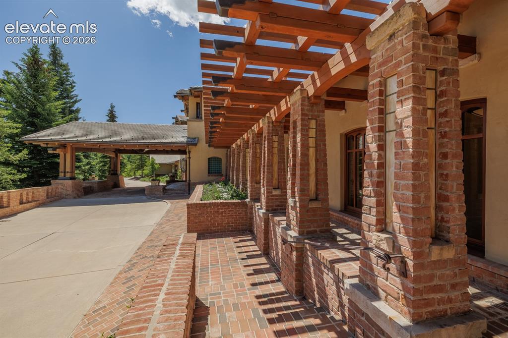 Image 3 of 49: Van Briggle tile on the exterior. Last major use of the tile which was once