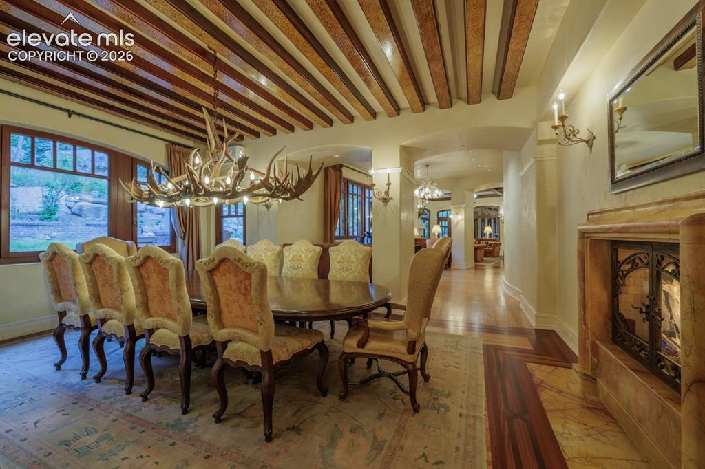 Image 32 of 49: Music room from living room to dining room with custom Albertini windows th