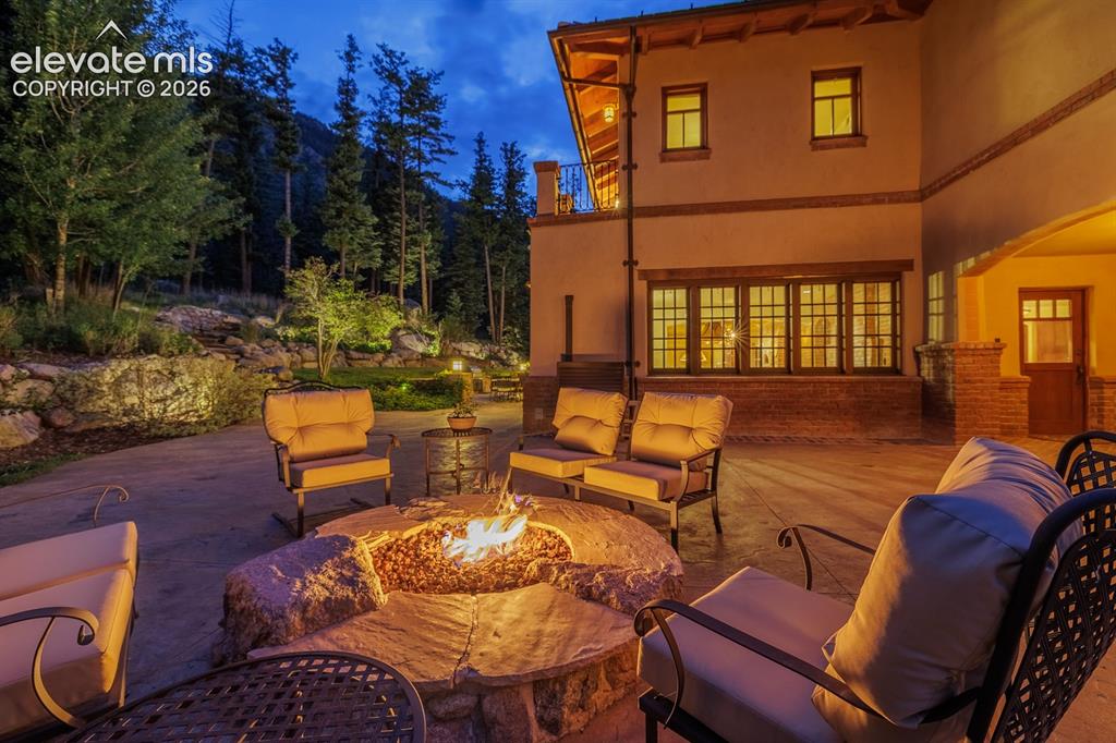 Image 36 of 49: Copper hood, tumbled marble countertops, two dishwashers, family room conne
