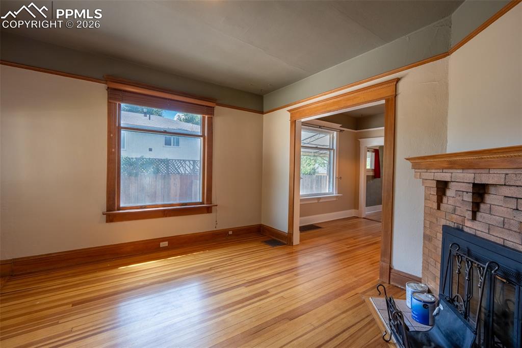 Image 5 of 24: Living room with light wood-style flooring and a fireplace
