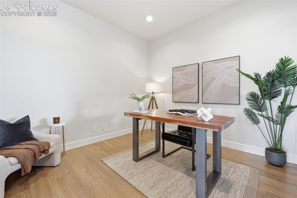 Image 14 of 39: Dedicated main level office with a Mountain View  featuring wood-finish flo