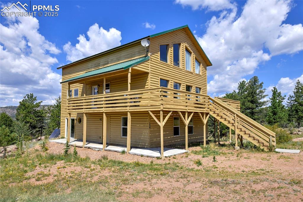 Caption: View Of Home, Deck, And Patio 
