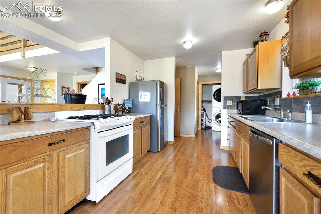 Image 17 of 48: Kitchen With View Into Laundry 