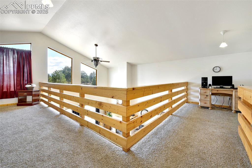 Image 28 of 48: Upper Level Hallway With View Of Smaller Loft Area 