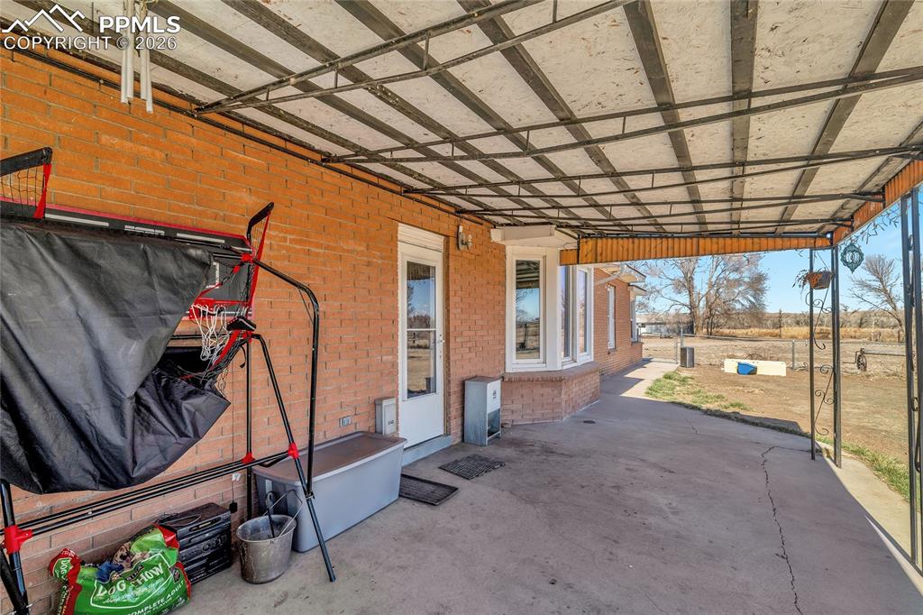 Image 11 of 49: View of dirt / gravel road with a view of rural / pastoral area