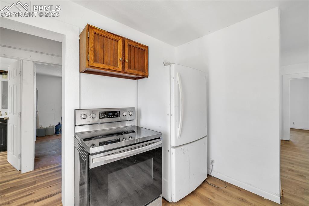 Image 36 of 49: ADU Bathroom with vanity, shower / bath combination with glass door, light