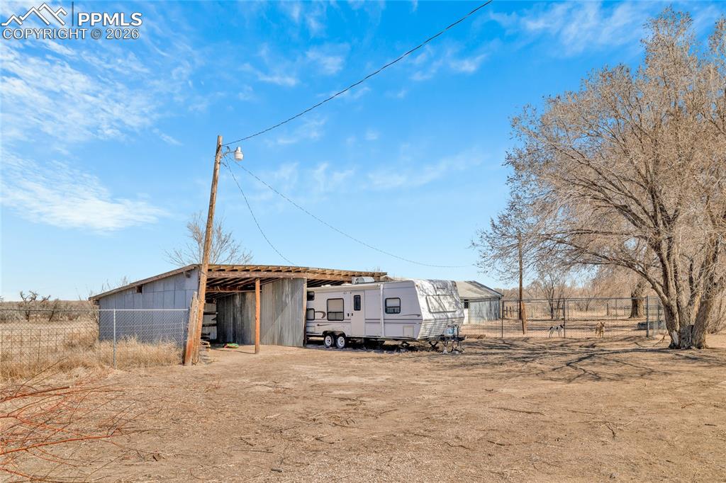 Image 41 of 49: ADU Unfurnished room with dark wood-style flooring and ceiling fan