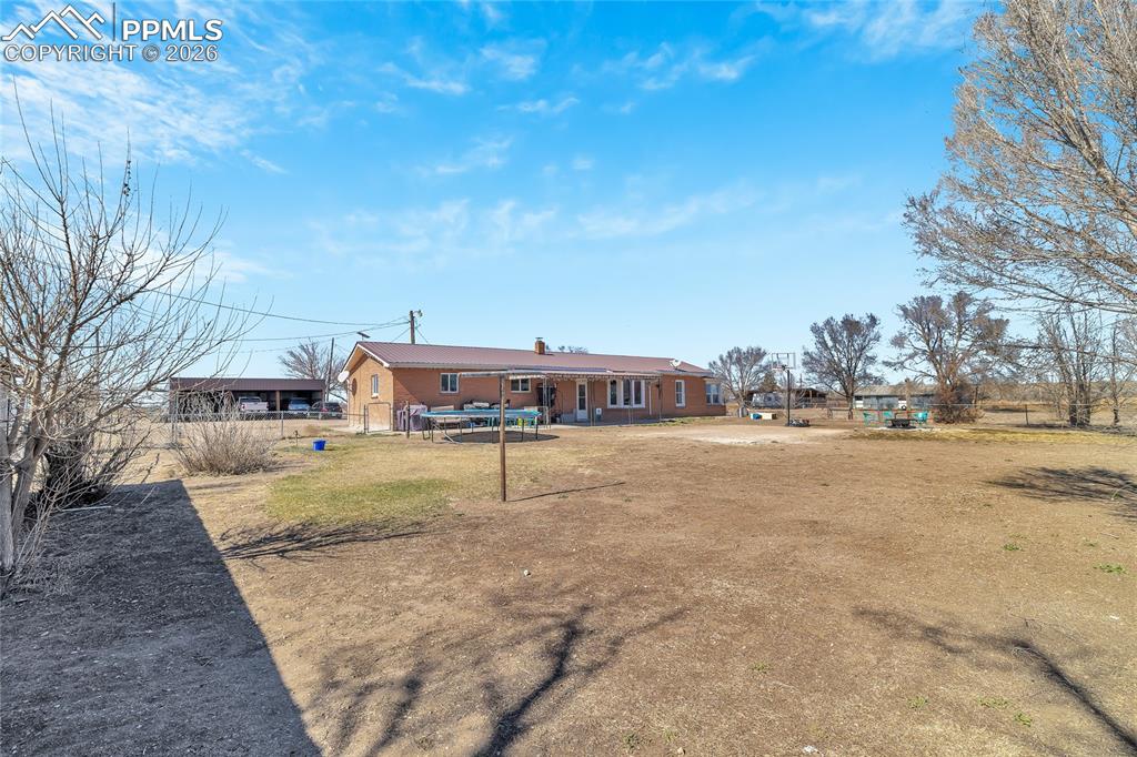 Image 49 of 49: View of yard with an outbuilding