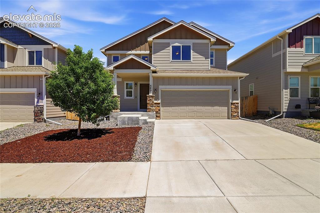 Image 1 of 30: Contemporary two-story residence featuring a neutral exterior, attached two