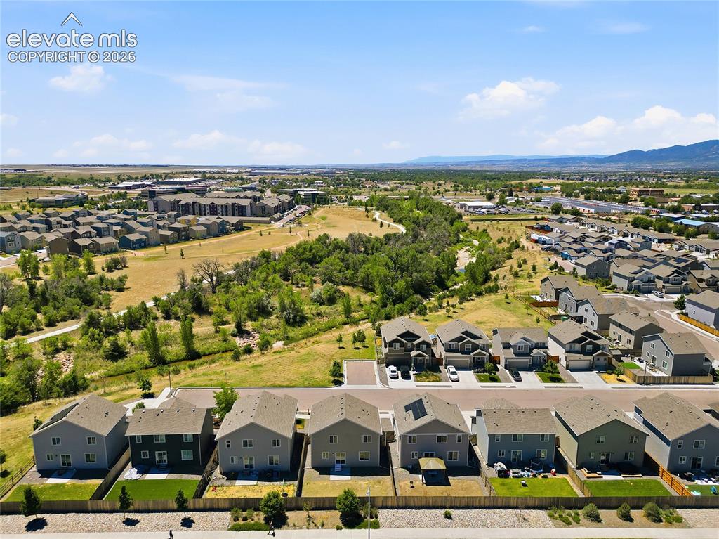 Image 27 of 30: Aerial perspective showcasing a residential development with varied housing